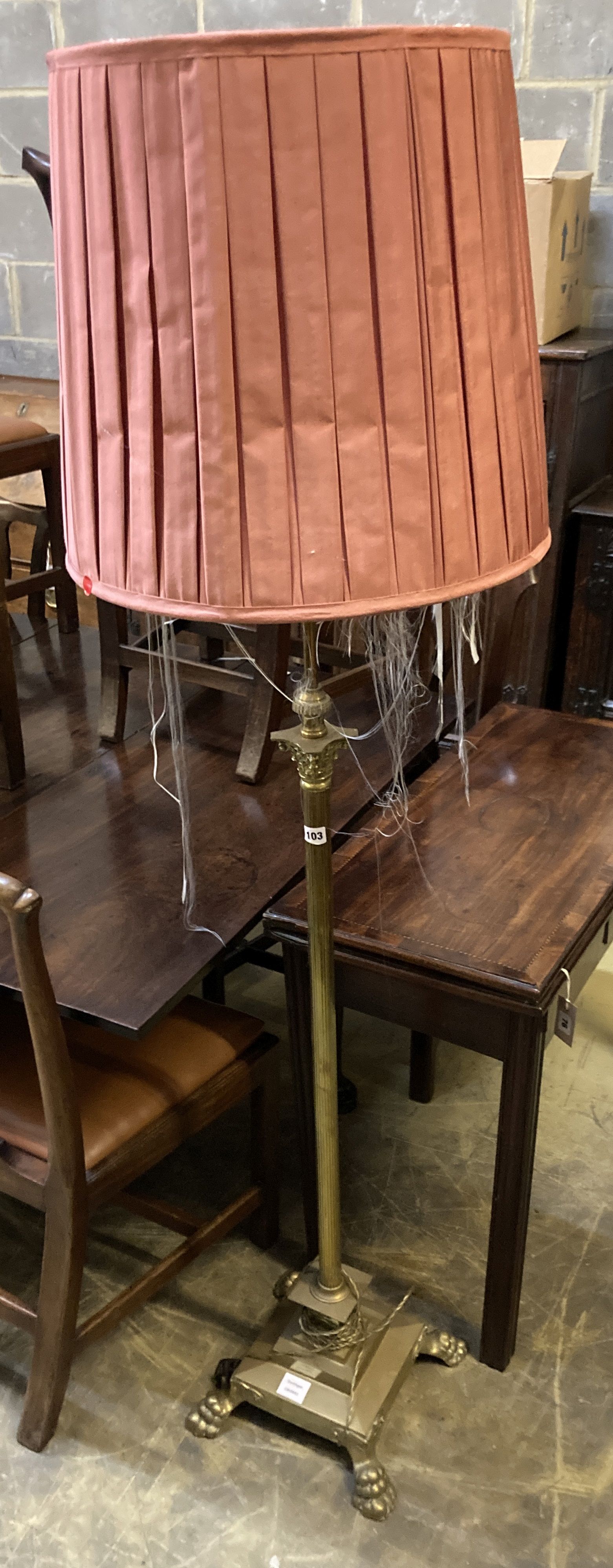 A brass Corinthian column adjustable standard lamp